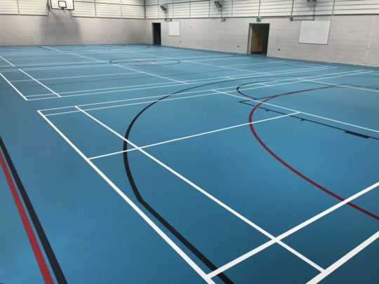New Blue Pulastic school indoor sports hall floor with court markings