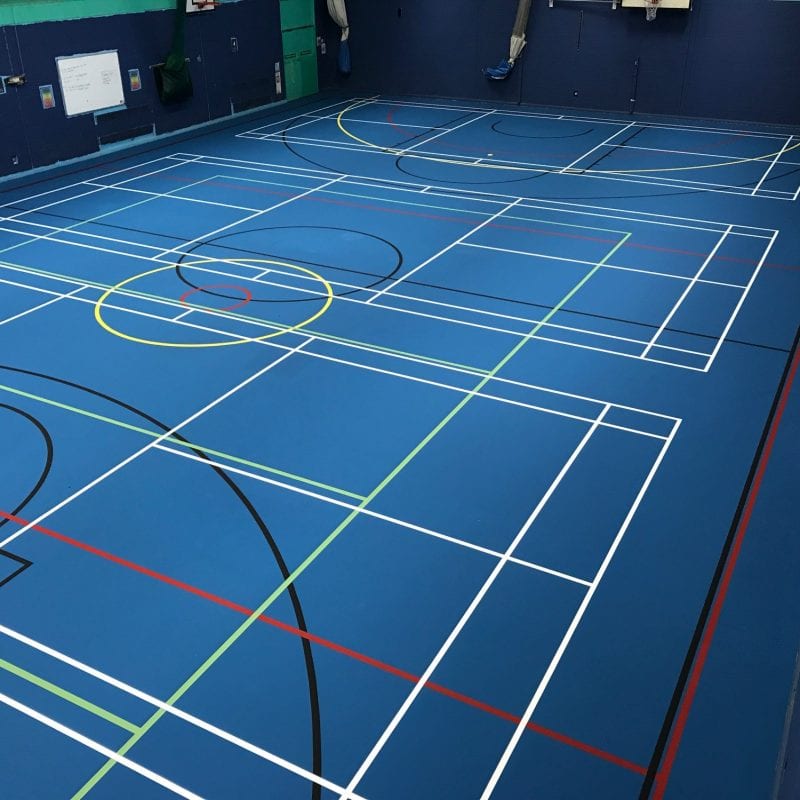 Blue Pulastic sports hall floor installed by Sports Surface UK with court markings