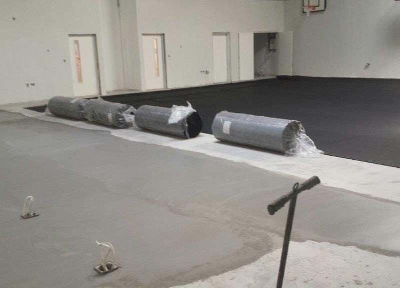 Installation school pulastic indoor sports floor by Sports Surfaces UK