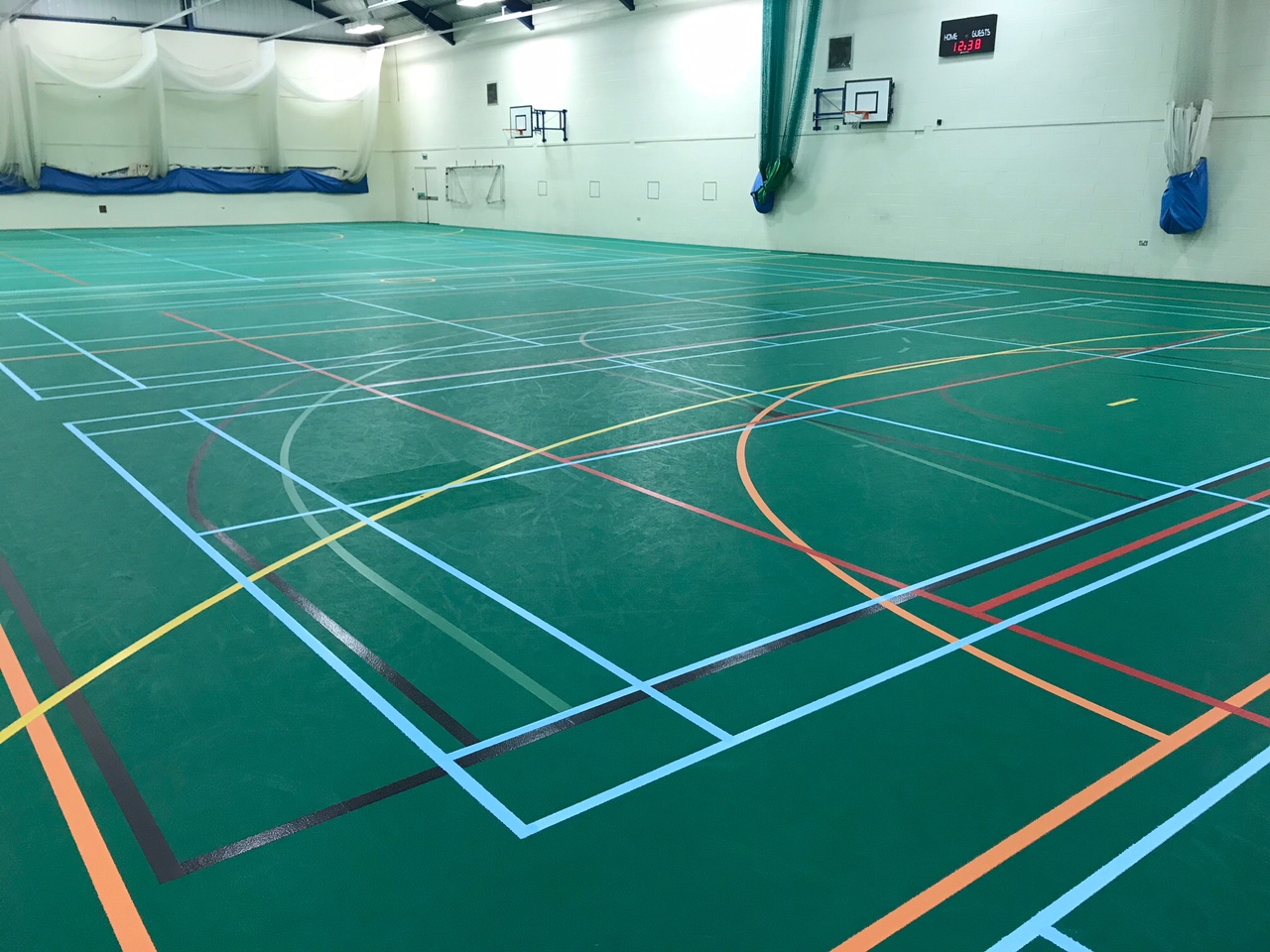School sports hall floor after Deep clean and refurbishment by Sports Surfaces UK