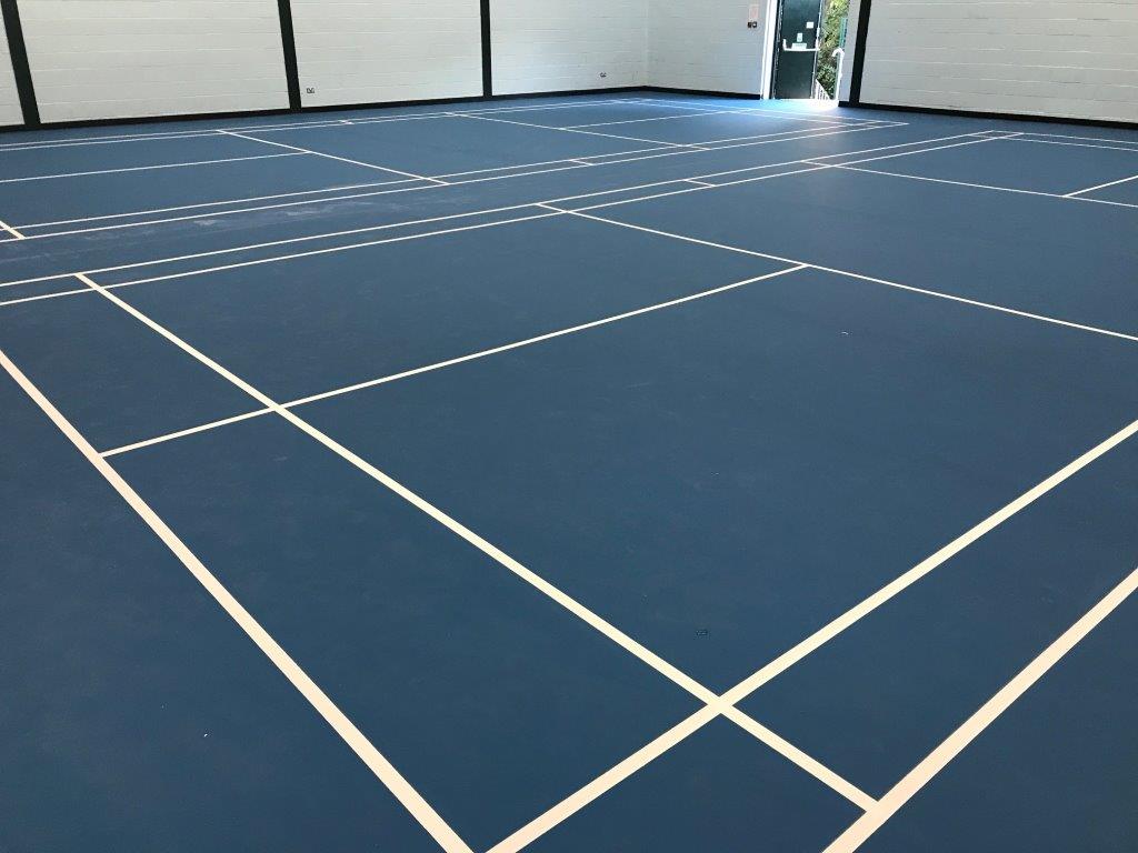 Sports centre sports hall installation of pulastic floor with court markings