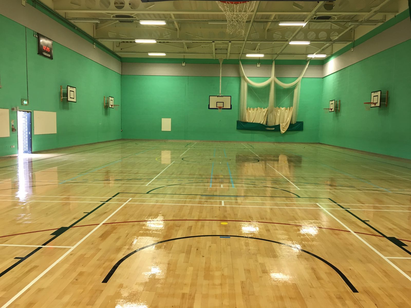 School Timber sports hall court refurbishment with court markings by Sports Surfaces UK