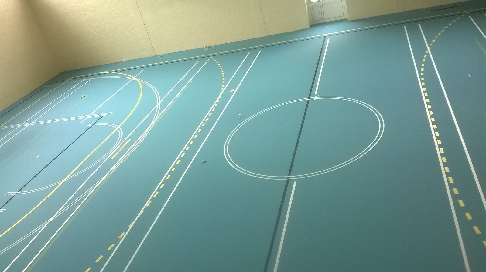 Installation of Pulastic Sports hall floor with court markings by Sports Surfaces UK