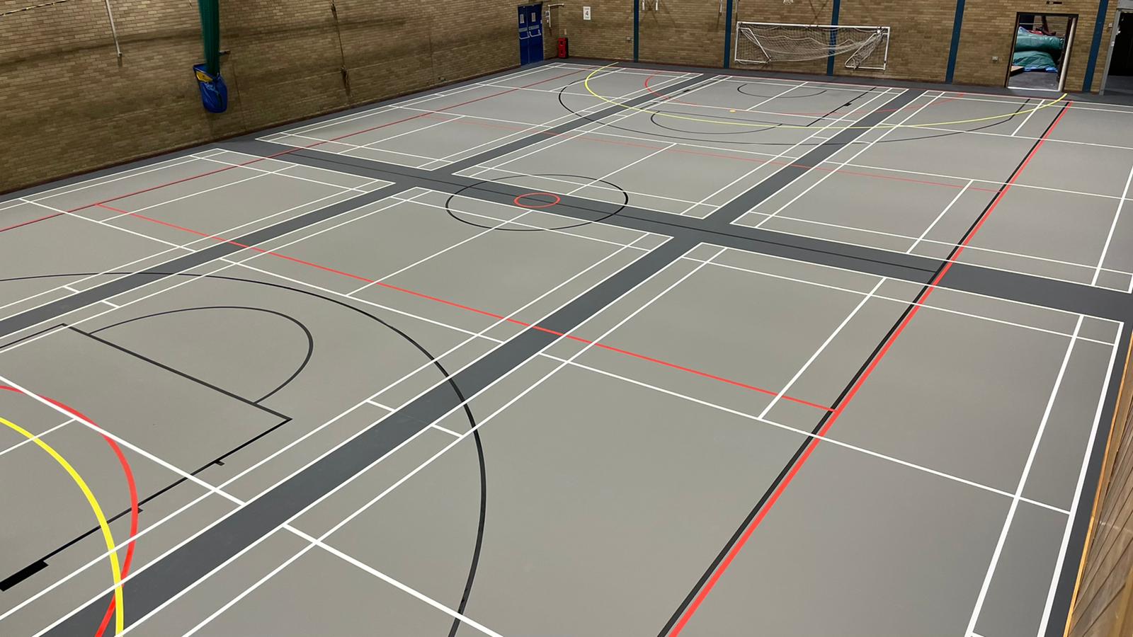 n old Granwood floor transformed into a new dusty and iron grey multifunctional sports floor at Barry Leisure Centre.